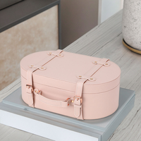 Boîte en cuir rectangulaire rose avec coins arrondis, avec poignée, artisanale, emballage cadeau rectangulaire, design élégant