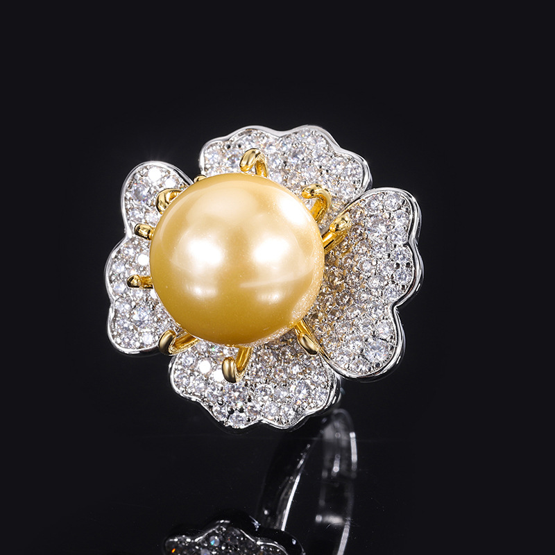 Bague ouverte en or avec perle