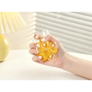 Jouet anti-stress souple et mignon en forme de bouton orange coloré sur le thème alimentaire, pour tous les âges - Product Image 3