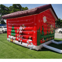Maison de Noël gonflable personnalisée commerciale de sortie d'usine maison de la grotte du père noël avec lumière led pour la décoration de fête