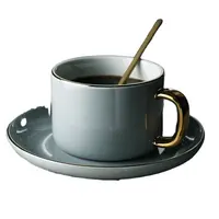 Venta al por mayor blanco gris esmalte café tazas de té mango de oro porcelana taza de café y platillo