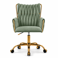 Fauteuil de détente en velours rouge, capitonné, dossier haut, siège pivotant réglable en hauteur, base en métal doré avec roulettes