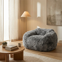 Fauteuil en tissu bouclé doux et moelleux, style Soft-Trend, sans assemblage requis, avec noyau en mousse élastique, idéal pour les petits espaces, assise effet nuage.