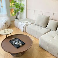 Canapé d'angle moderne inclinable avec rembourrage capitonné, emballé sous vide et compressé directement de l'usine, idéal pour appartement et salon