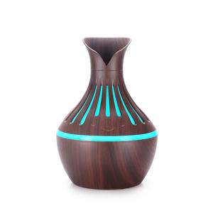 Diffuseur d'arômes en forme de vase ajouré, mini humidificateur à pétales, alimenté par USB, lumière 7 couleurs, usage domestique, version améliorée - Product Image 1