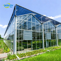 Serre en verre multi-chapelles de type Venlo pour usage commercial, verre horticole de 4 mm, système hydroponique intelligent pour fleurs