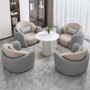 Ensemble de canapés de réception ronds en cuir, style minimaliste moderne, avec une table et quatre chaises rembourrées en éponge, pour usage commercial et de bureau - Product Image 1