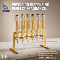 BANMO Distributeur de parfum 6 bouteilles avec cadre doré, réservoir en verre, valve à pression, station de remplissage et de transfert de parfum pour comptoir
