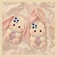 Coque de téléphone antichoc en silicone avec oreilles de lapin en peluche et design de dessin animé pour toutes les séries d'iPhone, y compris iPhone 17, 16, 15, 14
