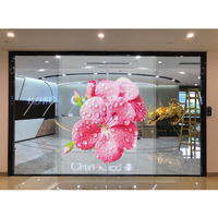 Écran mené flexible transparent de film de fenêtre en verre de signe de rideau d'intérieur P3.9-7.8 mince superbe pour la publicité de magasin