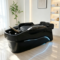 Lit de lavage électrique de luxe pour salon de coiffure moderne, avec cadre noir, fonction massage et circulation d'eau pour spa capillaire