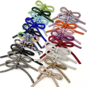 RE014 ホットセール ラインストーンボウブローチ ハンドメイド ラインストーンラウンドチューブロープボウノット 衣類用 - Product Image 1