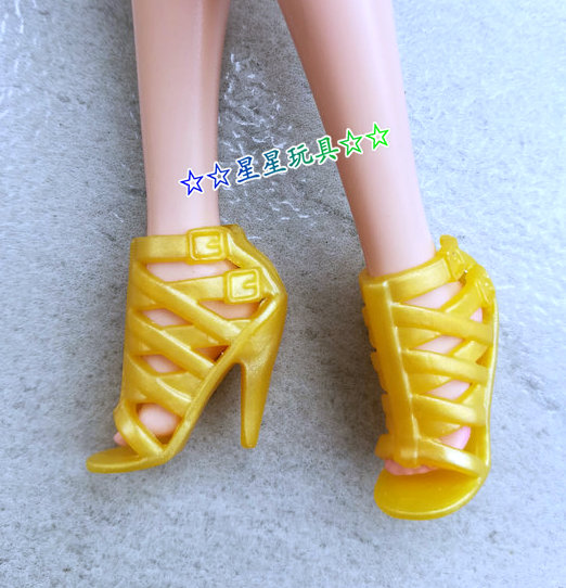 Gold-fr2 wearable-shoes worn by petite barbie doll as picture