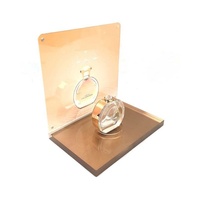 Porte-bouteilles de parfum cosmétique en acrylique de luxe Présentoir de point de vente de grand magasin de beauté en or rose avec affiche modifiable