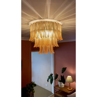 Plafonnier en verre Plume, hauteur réglable, longue suspension ronde en fer doré