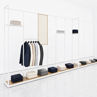 Porte-vêtements mural linéaire fin en métal noir avec accent grille dorée et base en bois – Fabricant