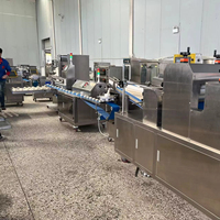 Machine automatique d'agencement de plateaux Hengyuan, puissance 2,8 kW, pour la mise en assiette des aliments, le traitement de la farine et la fabrication du pain, avec cadre en SUS304