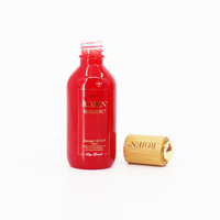 Bouteille compte-gouttes d'huile essentielle en verre à pompe à bouton-poussoir 30ml bouteille d'emballage compte-gouttes cosmétique en verre rouge pour huile de sérum cosmétique