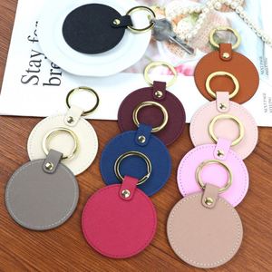 พวงกุญแจหนัง PU ทรงกลม 10 สี แบบสองด้าน เหมาะสำหรับการปั๊มฟอยล์ร้อน - Product Image 1
