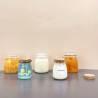 Bocal en verre transparent personnalisable pour le stockage des aliments pour l'emballage d'épices de confiture de lait de yaourt