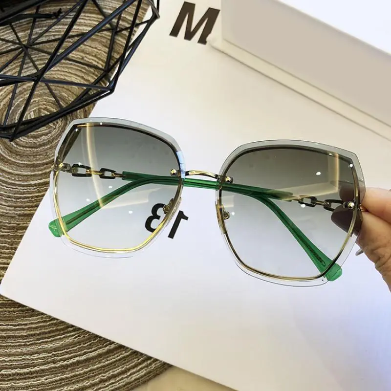 DL Kacamata Hitam Desainer Mode untuk Wanita Grosir Kacamata Hitam Tanpa Bingkai Bingkai Logam Kacamata Uv400 Panas Tanpa Bingkai