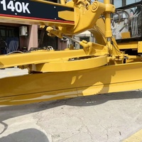 Niveleuse Caterpillar 140K d'occasion - Multifonctionnelle pour le nivellement Prix abordable avec 1 an de garantie