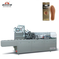 Machine d'emballage et de cartonnage pour semelles de chaussures