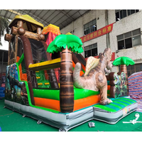 Structure gonflable à thème volcan dinosaure avec toboggan, combo de jeux gonflables pour enfants, idéal pour les fêtes en plein air et les aires de jeux.