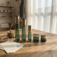 Lot de cosmétiques en verre écologique et recyclable avec bouchons à vis, pots à lotion et crème sérigraphiés pour l'emballage de produits de soin de la peau