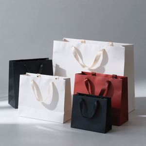 Wholesale Custom Logo Paper Carrier Luxury Cardboard Gift Packaging <b>Bags</b> With Ribbon Bow for Christmas Birthday Party - Product Image 1