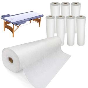 Rollo de sábanas desechables de tela no tejida precortadas con orificio para la cara, para camillas de masaje, salones de belleza, hoteles y mesas de examen. - Product Image 3