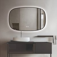Miroir de salle de bain LED rectangulaire incurvé encadré, avec éclairage à intensité variable et fonction anti-buée
