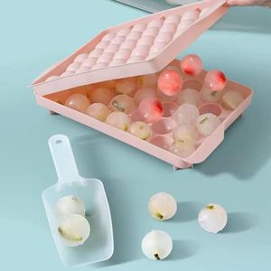 Moule à glaçons rond en silicone pour petites sphères avec rebord et plateau circulaire en plastique - Product Image 1