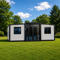Cabine mobile modulaire préfabriquée de luxe de 40 pieds avec cadre noir et jaune désert, extensible, pour hôtel ou resort