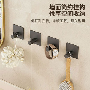 ตะขอแขวนผนังแบบมินิมอล สีดำ แพ็ค 4 ชิ้น ติดตั้งด้วยกาว ไม่ต้องเจาะผนัง ใช้แขวนเสื้อผ้าในห้องน้ำ หรือเก็บกุญแจ - Product Image 1