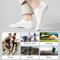 Vente en gros de chaussettes en bambou blanc bon marché Chaussettes d'affaires unisexes de couleur unie Chaussettes jetables pour femmes et hommes