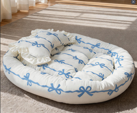Lit pour chien et chat en peluche moderne, mignon et apaisant, en forme de beignet, avec tapis intégré