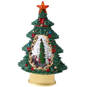 回転オルゴール付きのクリスマスツリーで装飾された音楽が光るハイエンドのクリスマスツリーとクリスマスプレゼント