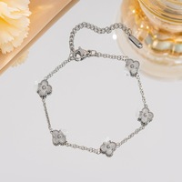 Bracelet de haute qualité, classique, en acier inoxydable plaqué or, double face, à quatre pétales de fleurs, adapté aux hommes et aux femmes
