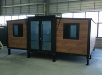 Maisonnette préfabriquée moderne de luxe en acier extensible, résistante à l'eau et au feu, utilisable comme villa, salon, appartement ou chambre.