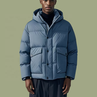 Veste matelassée personnalisée OEM ODM en duvet de canard blanc à 90 % pour homme, à capuche, coupe oversize, avec poches à rabat à double fermeture, décontractée pour l'hiver