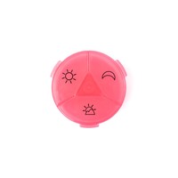 Boîte à pilules ronde en plastique rose avec des icônes soleil et lune pour le rangement des médicaments