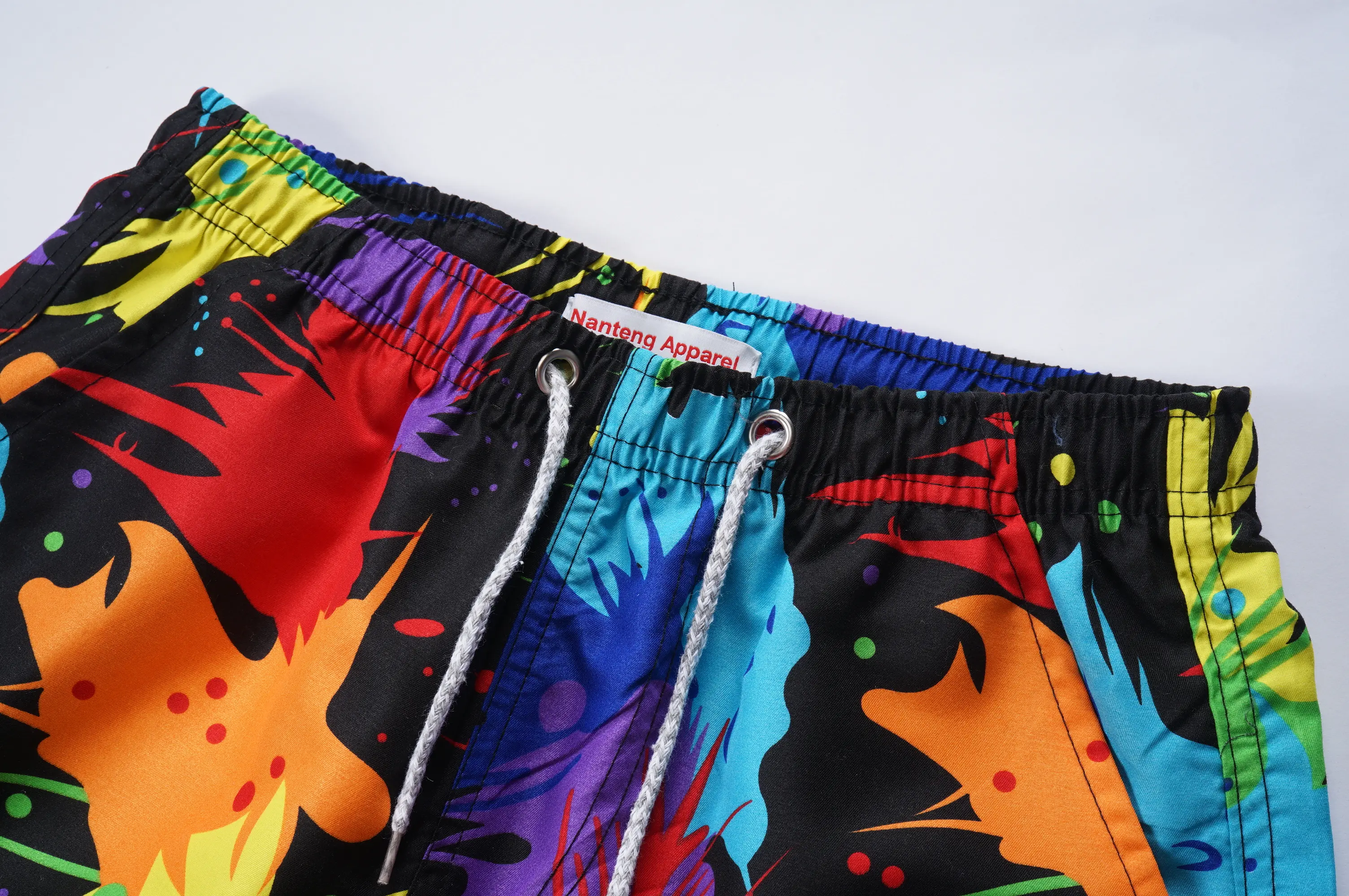 Nanteng personalizado de alta calidad poliéster verano sudor tiene bolsillos Jogger pantalones OEM sublimación pantalones cortos de natación para hombre