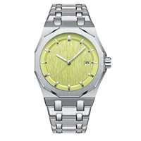 Montre pour homme avec lunette octogonale en acier inoxydable, cadran brossé, index lumineux, bracelet intégré, affichage de la date
