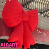 Nœud gonflable personnalisé à suspendre pour la décoration murale des centres commerciaux en extérieur, Nœud gonflable rose pour les événements publicitaires de marque