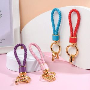 <span class=keywords><strong>Porte</strong></span>-clés en cuir tressé OEM avancé, vierge, fait main, multicolore, pour clés de voiture, avec cordon, accessoires de pendentif, vente en gros - Product Image 1