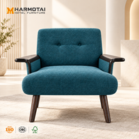 Fauteuil d'hôtel commercial avec structure en bois massif et revêtement en tissu pour projets hôteliers