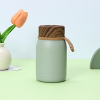 Bouteille isotherme compacte et portable en acier inoxydable avec couvercle imitation bois, idéale pour l'extérieur