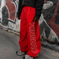 OEM ODM Maßgeschneiderte Herren Weite Hosen Nylon Wasserabweisende Baggy Loose Fit Buchstabendruck Fallschirmhosen Lässige Streetwear