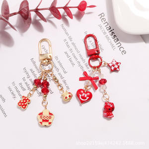 จี้พวงกุญแจรูปตัวอักษรดอกไม้ปีใหม่น่ารักแมวโชคดีหัวใจอุปกรณ์ตกแต่งเคสหูฟัง - Product Image 1